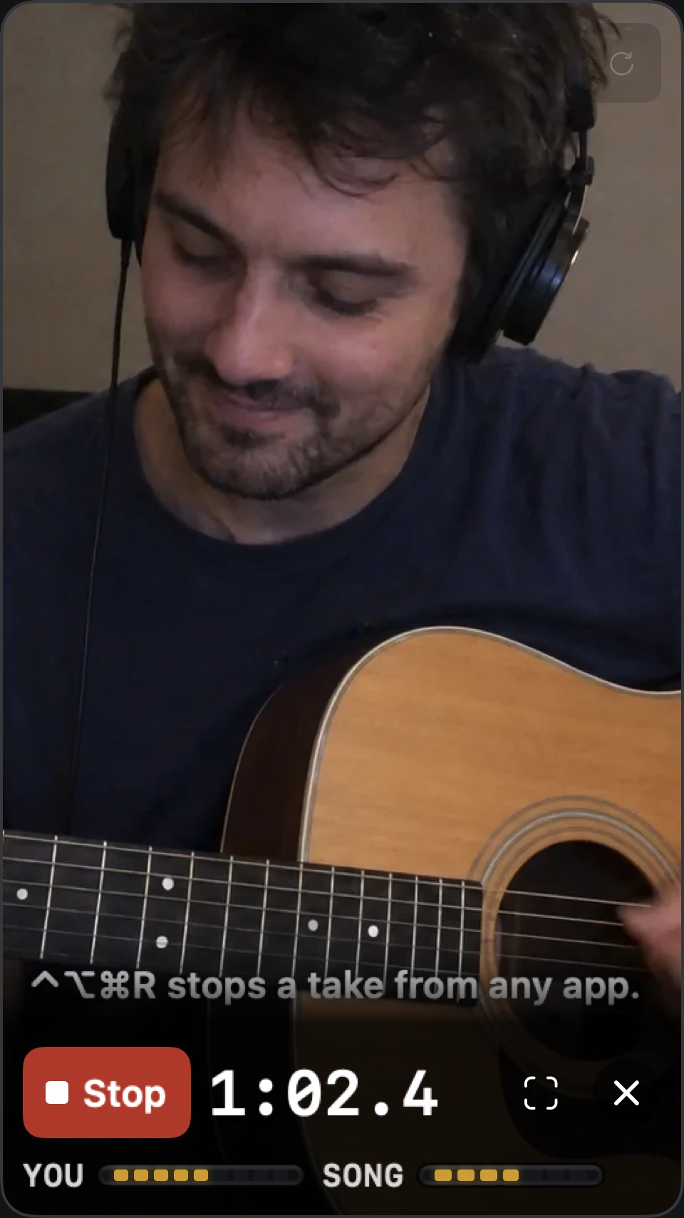 Afinar filming a guitarist in portrait, with Stop, the take timer and the You and Song meters